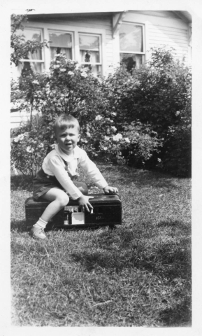 Nester and Covey family - young boy playing in the yard 1930s