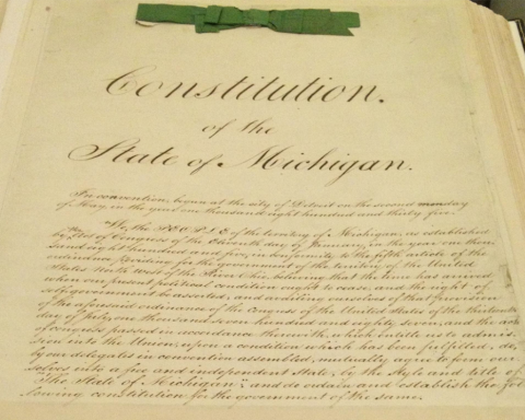 Photograph of original Michigan Constitution with green ribbon
