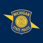 Shield shaped seal in gold and blue with Michigan State Police in text.